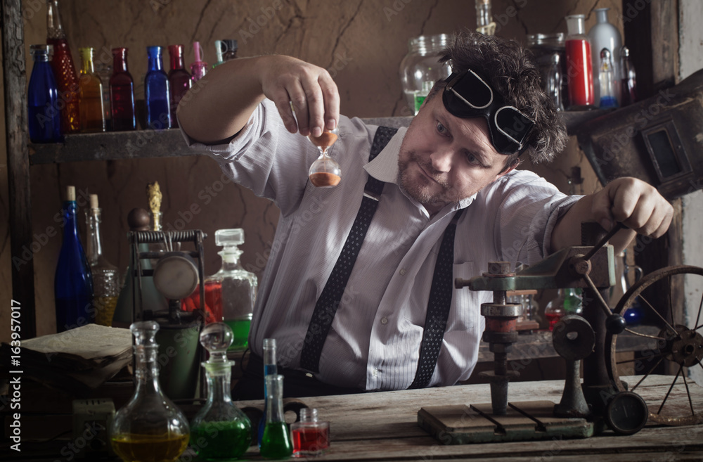 crazy medieval scientist working in his laboratory crazy medieval scientist working in his laboratory