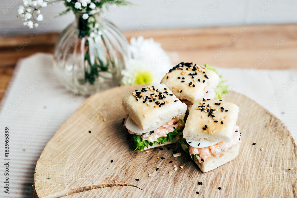 Selection of very tasty and delicious party snacks, little sandwiches with sesame seeds, gourmet food Selection of very tasty and delicious party snacks, little sandwiches with sesame seeds, gourmet food