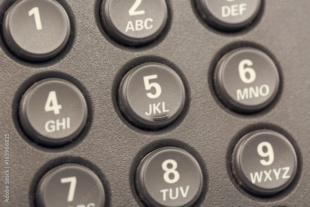 Modern IP digital phone buttons with numbers close up with selective focus. Toned Modern IP digital phone buttons with numbers close up with selective focus. Toned