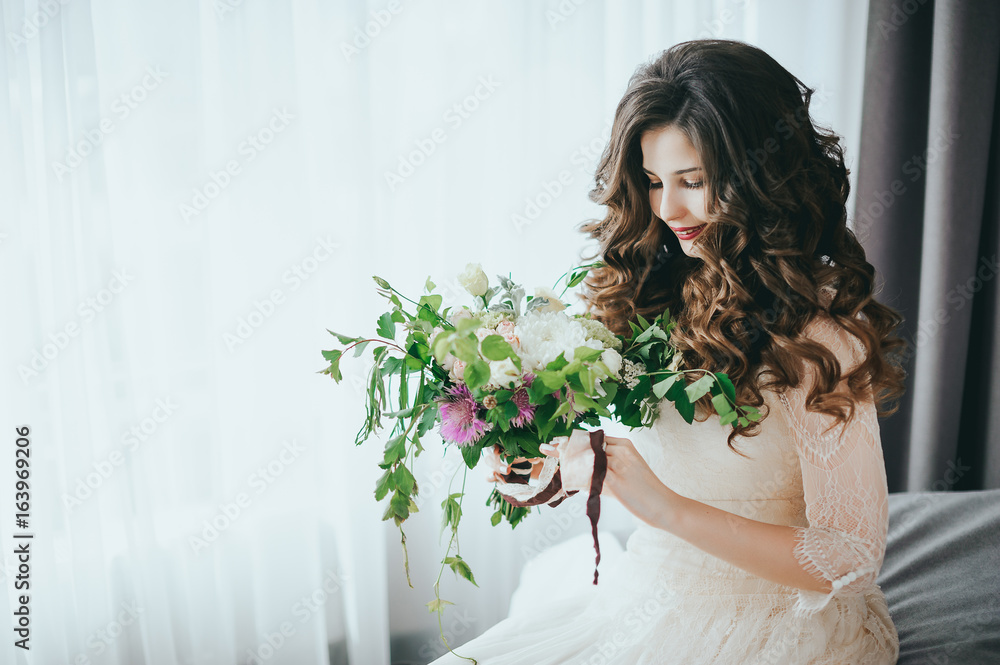 Bride with a beautiful bouquet of different colors.