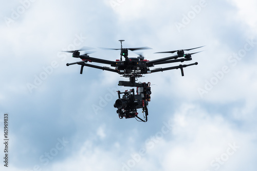 Drone with professional cinema camera flying