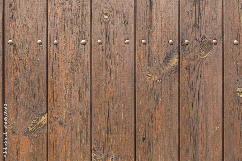 Fototapeta premium Wooden planks painted brown. Background texture