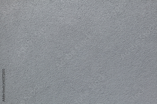 Grey painted stucco wall. Background texture