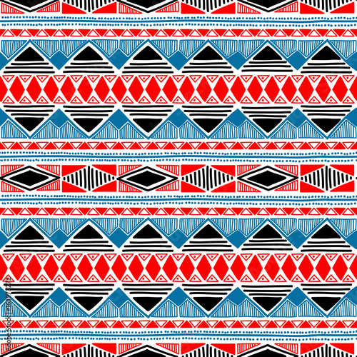 Seamless ethnic pattern. Blue, red, black and white colors. Handmade. Striped summer print. Aztec and tribal motifs.