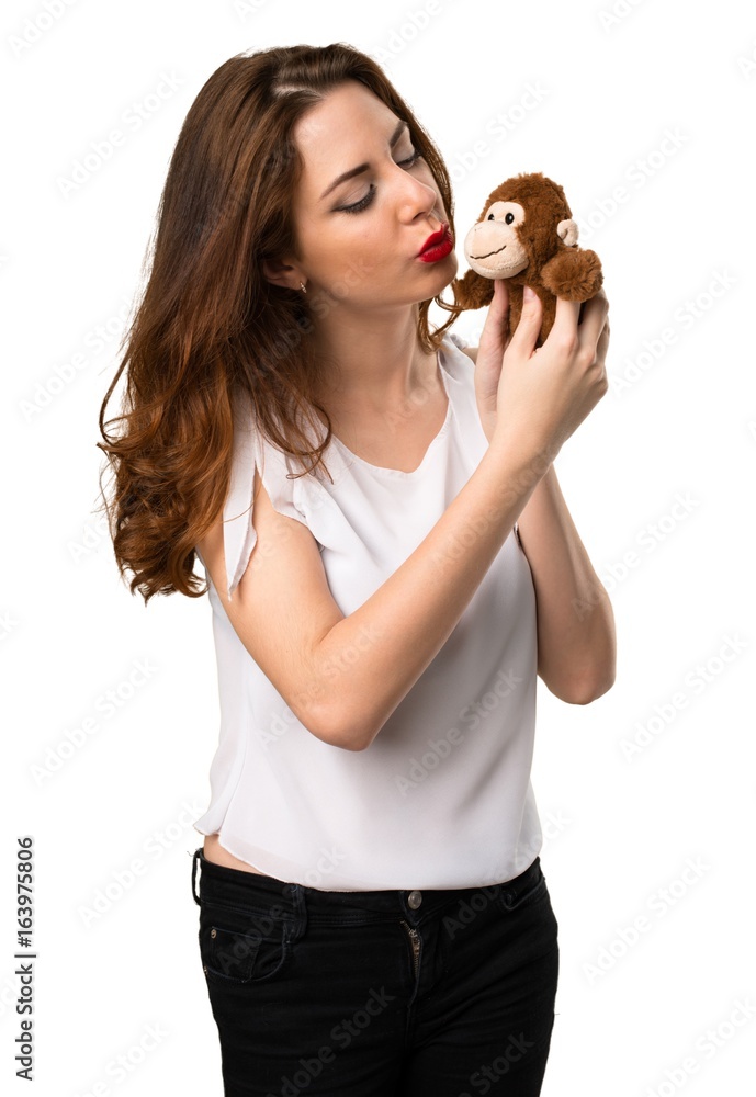 Beautiful young girl playing with a little stuffed animal Beautiful young girl playing with a little stuffed animal