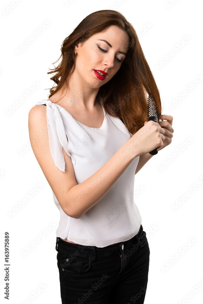 Beautiful young girl with hair comb Beautiful young girl with hair comb