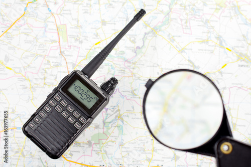 walkie-talkie map and magnifier loupe equipment concept search