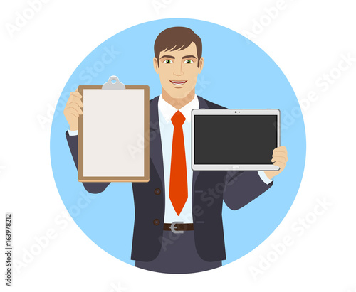 Businessman holding the clipboard and digital tablet PC