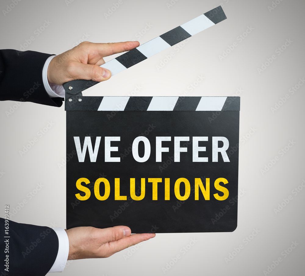 Obraz premium We offer solutions - clapperboard concept