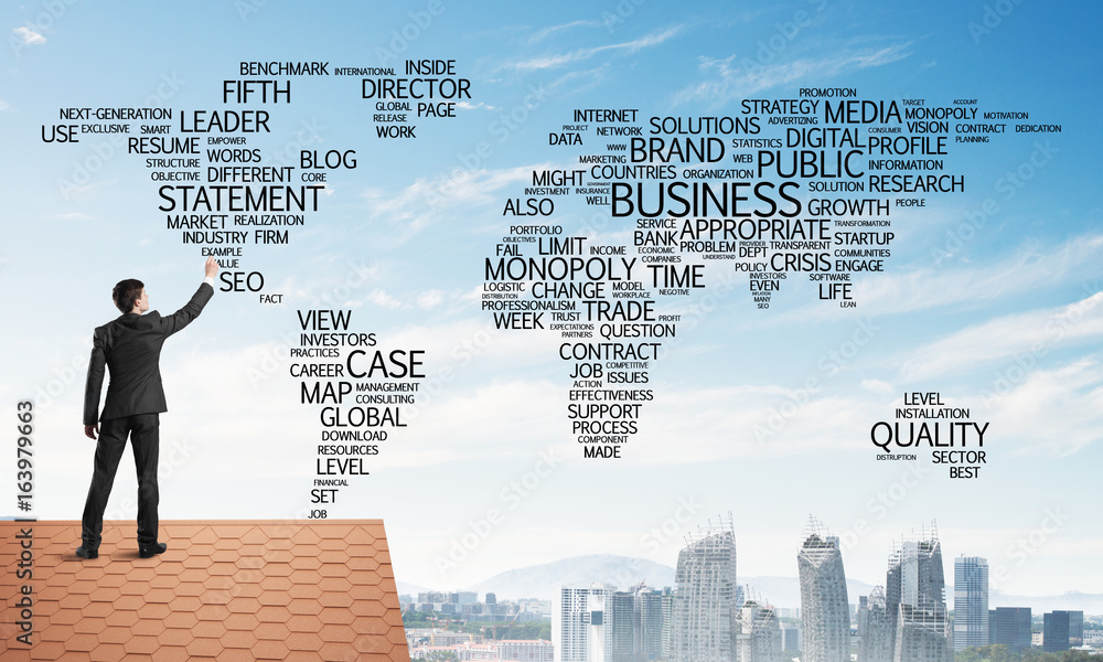 Businessman on brick roof draw world map as concept of globalization. Mixed media