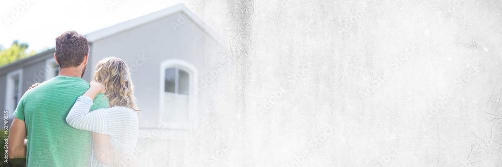 Fototapeta premium Couple looking at house with transition