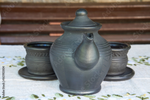 ceramic teapot with two cups of a tea