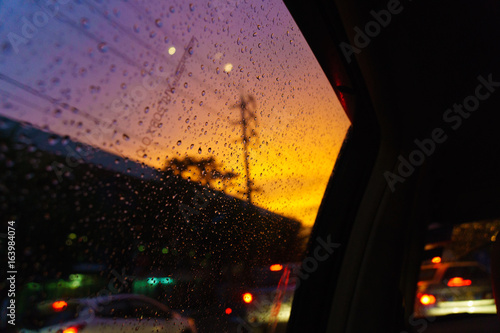 rain drop. colorful sky with traffic.