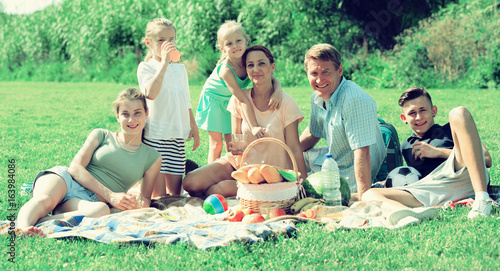 Parents with kids having picnic