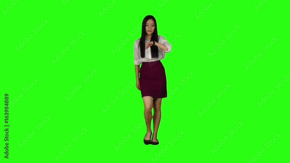 Girl with a phone is running to an important meeting. Green screen. Slow motion Girl with a phone is running to an important meeting. Green screen. Slow motion
