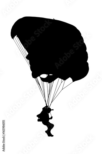Side profile silhouette of sky diver with open parachute