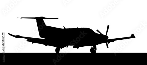 Side profile of a Pilatus-PC12 single prop aircraft