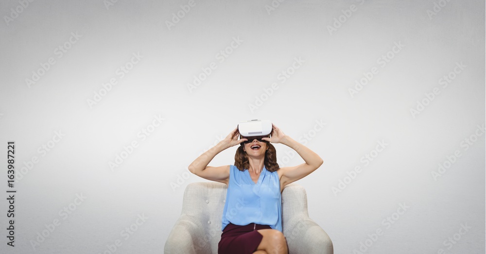 Woman in VR headset looking up against white background Woman in VR headset looking up against white background