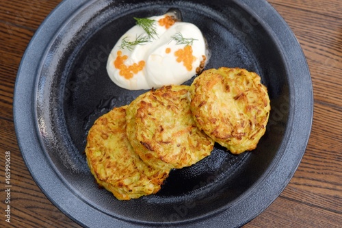 Vegetable patties with sour cream and caviar 
