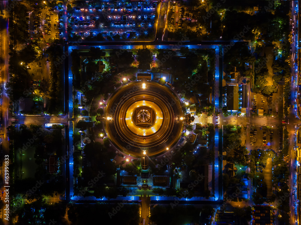 Aerial view Road roundabout with car lots in Bangkok,Thailand.Beautiful street in Bangkok.The light on the road at night and the city in Bangkok,Thailand.Lights of cars on the road.Phra Pathom Chedi. Aerial view Road roundabout with car lots in Bangkok,Thailand.Beautiful street in Bangkok.The light on the road at night and the city in Bangkok,Thailand.Lights of cars on the road.Phra Pathom Chedi.