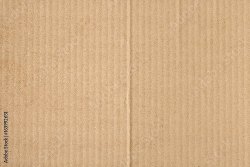 Closeup of the texture of the cardboard plate brown wallpaper background