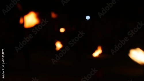 Wallpaper Mural Blurred View, Fire Show. Men make fire circles. Blurry background Torontodigital.ca