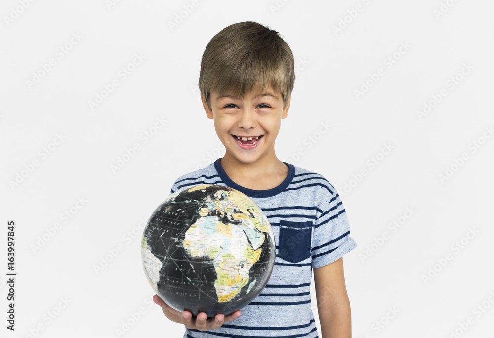 Caucasian boy smiling holding a planet orb Caucasian boy smiling holding a planet orb