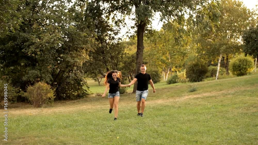 Pair of lovers strolling in the Park holiday Pair of lovers strolling in the Park holiday