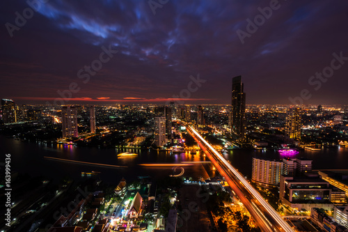 The light on the road at night and the city in Bangkok, Thailand on January 1, 2014.
