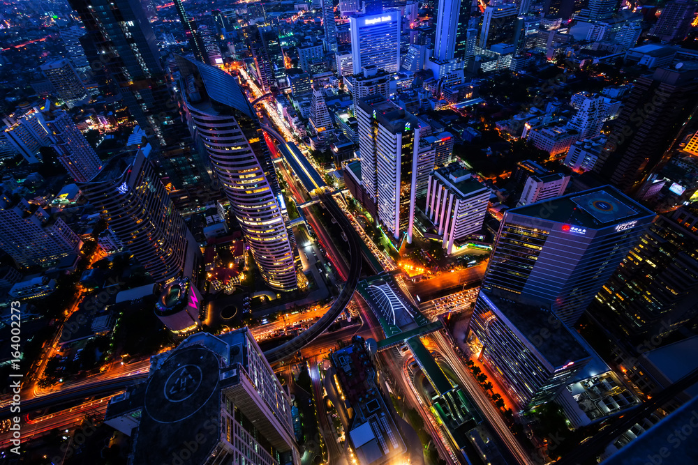 The light on the road at night and the city in Bangkok, Thailand on March 31, 2015.