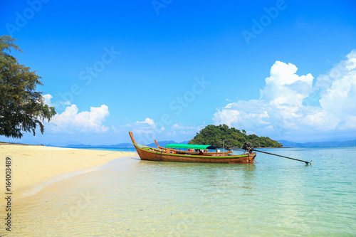Tropical beach, traditional long tail boats, Andaman Sea, Thailand © oatfeelgood