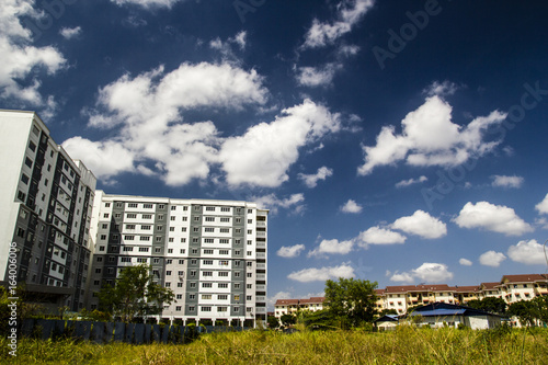 residential apartment with blue cloudy sky