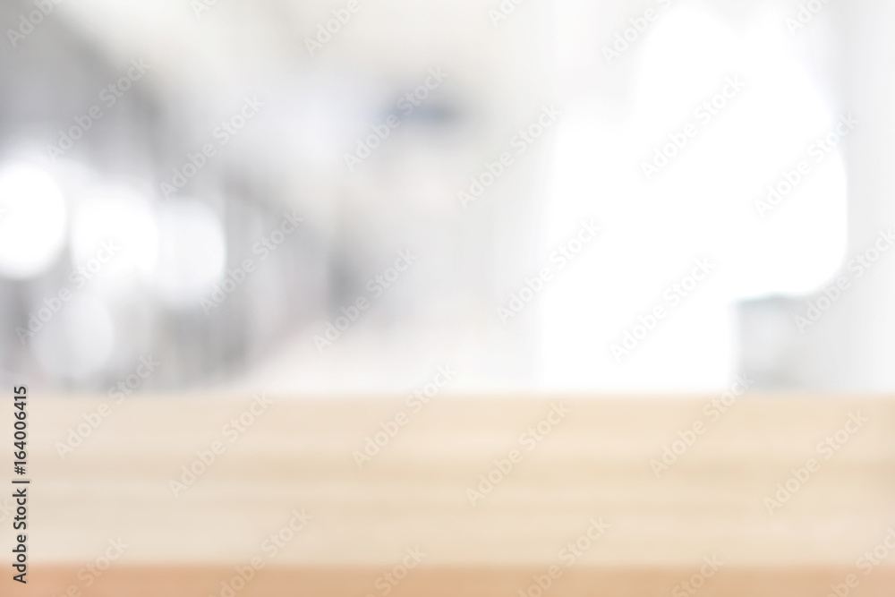 Blurred wood table top on white gray abstract background