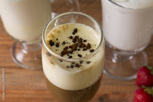 Eggnog on a wooden table. A festive egg drink. Christmas time.