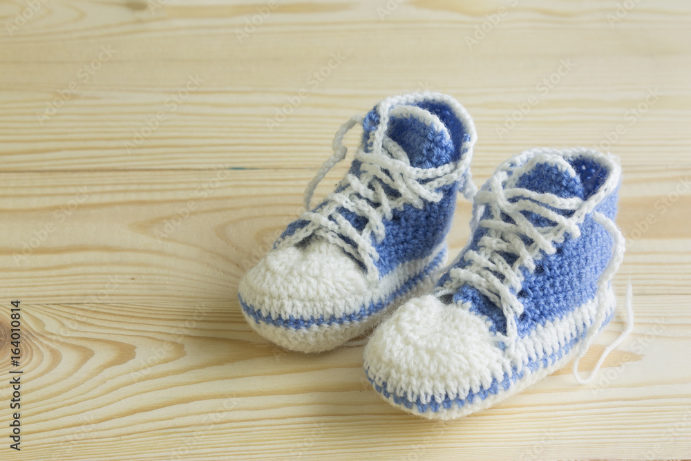 Knitted booties for newborns. Creative knitting.