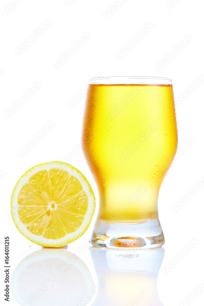 A healthy diet and lifestyle concept: Yellow fruit juice with orange isolated on white. Closeup. A healthy diet and lifestyle concept: Yellow fruit juice with orange isolated on white. Closeup.