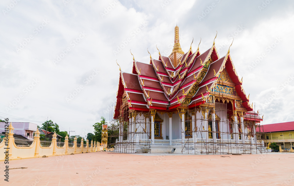 Beautiful temple is being renovated. In the sky with the clouds in the rainy season. Beautiful temple is being renovated. In the sky with the clouds in the rainy season.