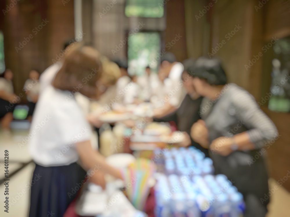blurred image of shopping mall and people or Businesswoman in Beauty Shop.