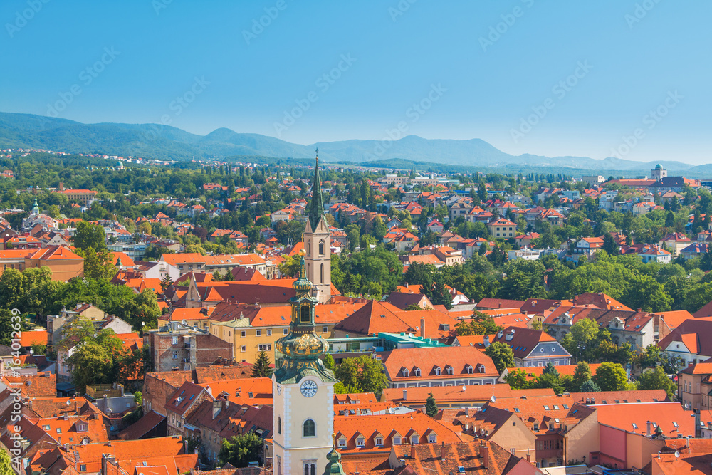      Zagreb center, aerial view, rooftops and church towers, Medvednica mountain in background 