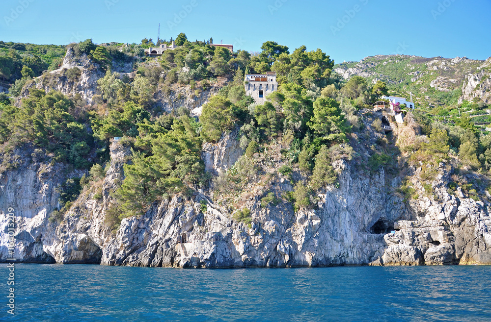 View of the Amalfi coast from the sea and and the old tower on the cliff