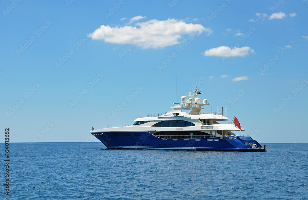 Bright blue powerboat on a clear sunny day