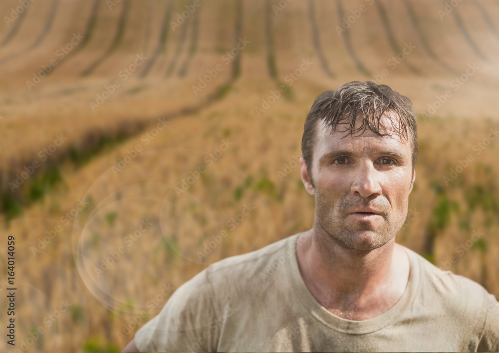Soldier man standing against a field Soldier man standing against a field