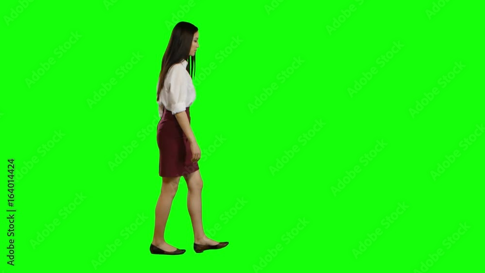 Girl goes to work and waves her hand. Green screen. Side view Girl goes to work and waves her hand. Green screen. Side view