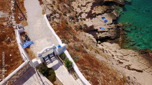 Aerial drone photo of small church of Agios Nikolaos and rocky seascape, Koufonissi island, small Cyclades, Aegean, Greece