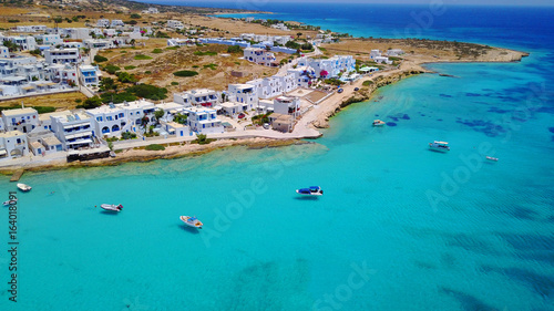 Fototapeta Naklejka Na Ścianę i Meble -  Aerial drone photo of iconic port of Koufonissi beach with docked fishing boats and turquoise waters, Koufonissi island, small Cyclades, Aegean, Greece