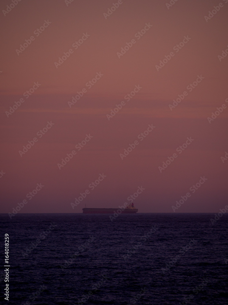 Coal ship on the horizon