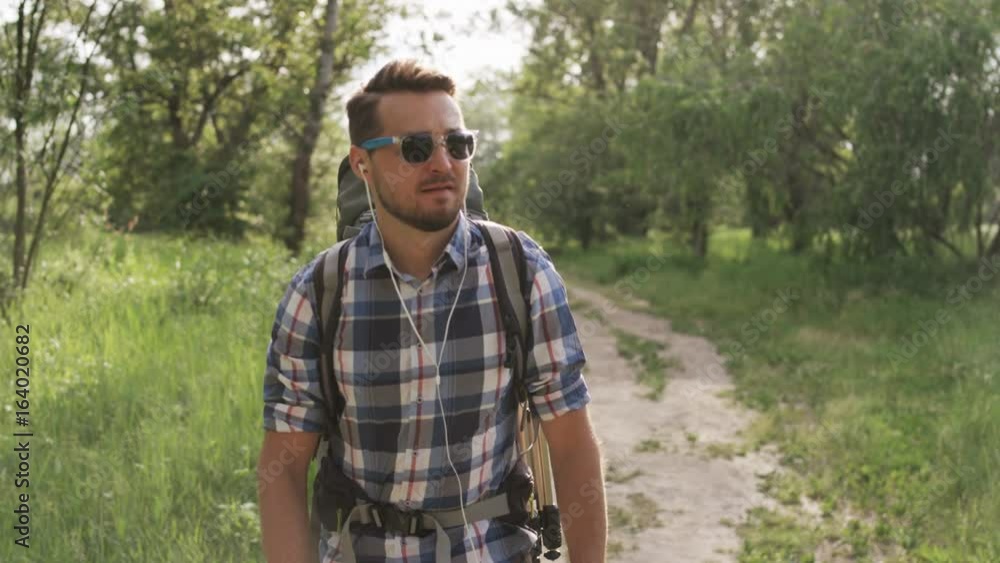 Young Man With Dark Glasses Walking in the Woods Young Man With Dark Glasses Walking in the Woods