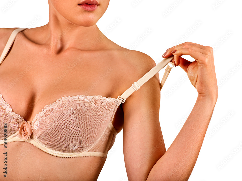 Foto Stock Self examination of women breast cancer. Woman wear lace bra.  Body part of girl with beautiful breasts and lips on white background  removes one strap bra with shoulder. Gentle profile