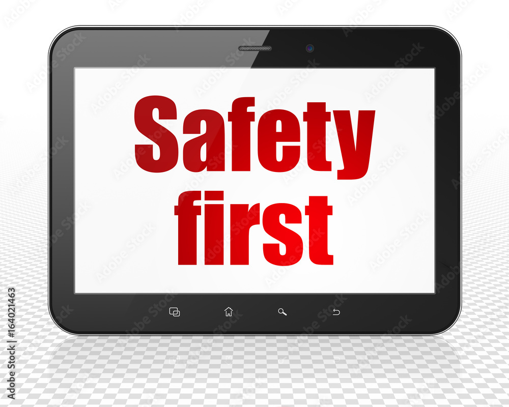 Protection concept: Tablet Pc Computer with Safety First on display Protection concept: Tablet Pc Computer with Safety First on display