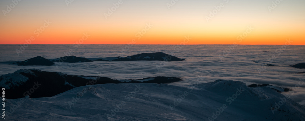 scenic sunrise, sunset in the winter mountains. mountain range